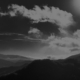 darkened cloudy hills